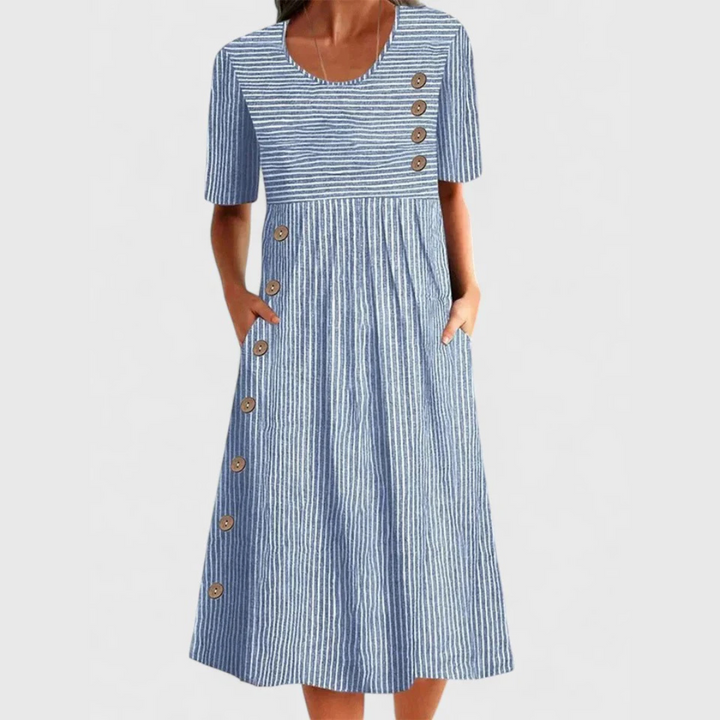 Women's blue striped midi dress with decorative button details, perfect for casual summer wear & relaxed daily style.