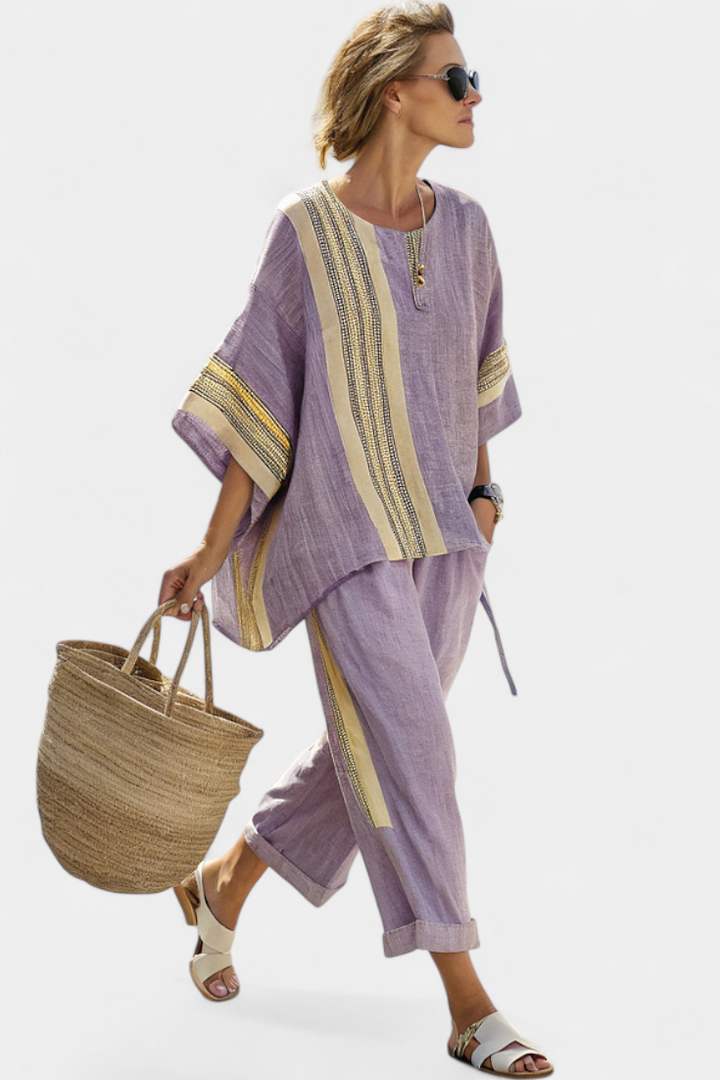 Chic women's bohemian striped two-piece lounge set. Versatile tunic & wide-leg pants for casual or resort wear comfort.