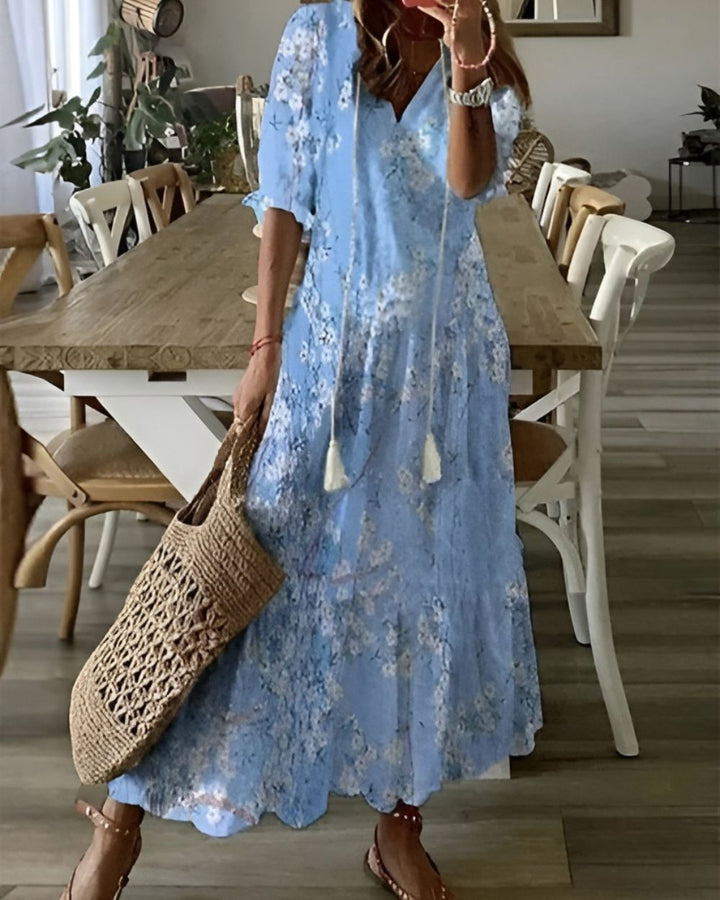 Stylish boho flowy maxi dress for women, featuring adjustable straps, great as a vacation or casual outfit.