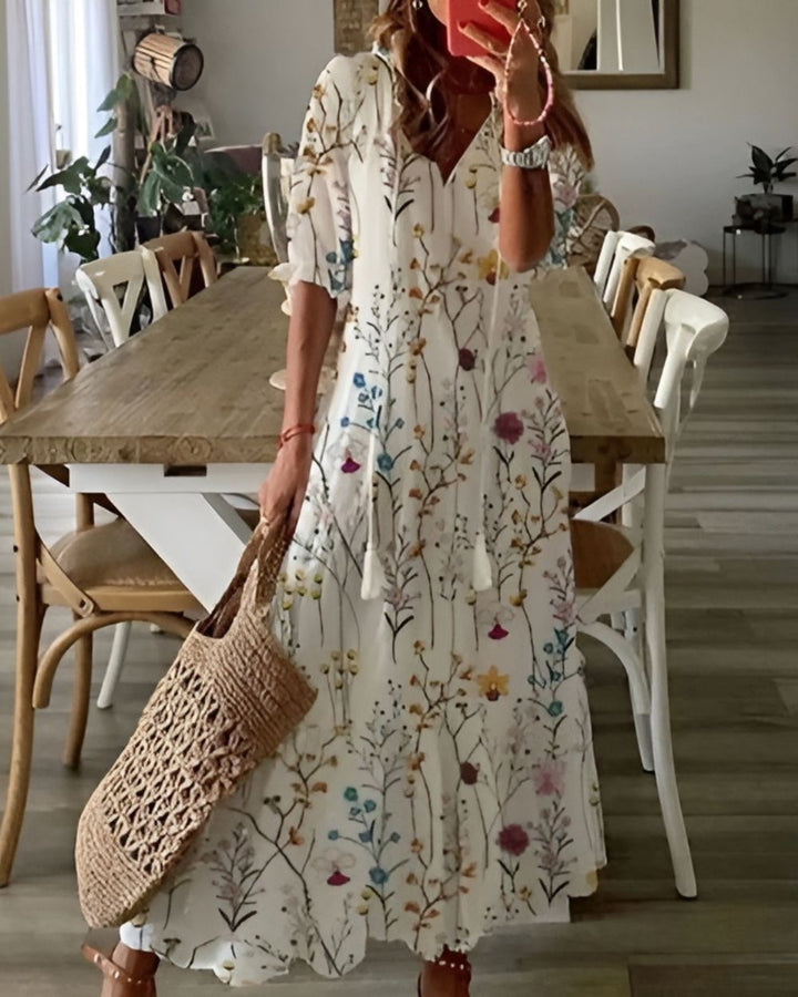 Boho flowy maxi dress with adjustable straps, an elegant women's vacation outfit for summer comfort.