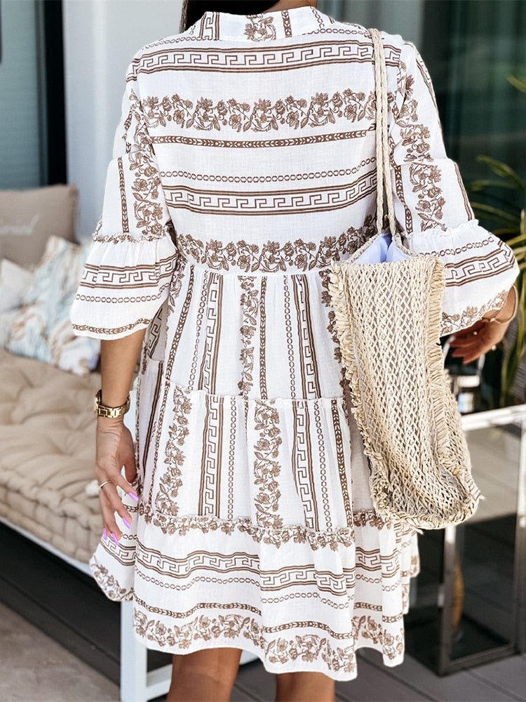 Printed boho mini dress for women, featuring trendy tiered flare sleeves, perfect for summer.