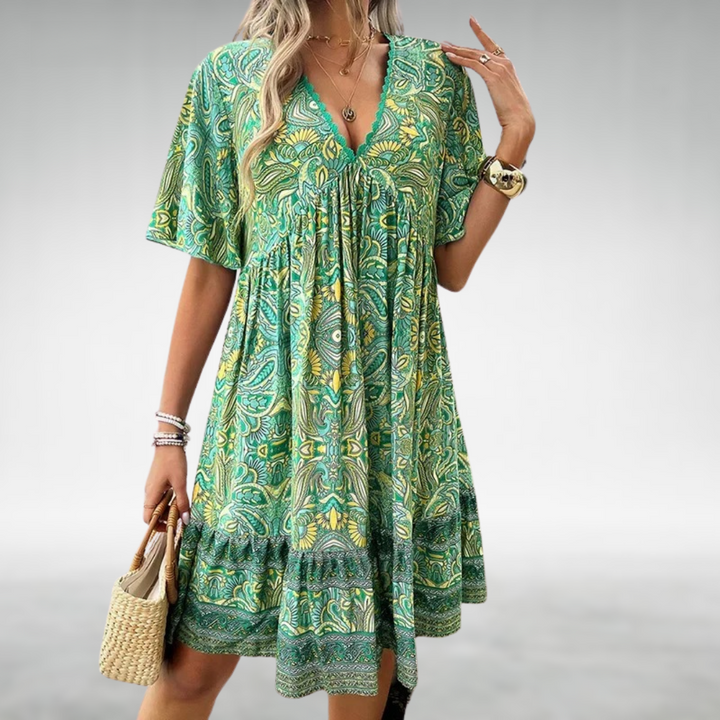 Relaxed fit women's boho mini dress featuring colorful paisley print & short sleeves, ideal for summer fashion.