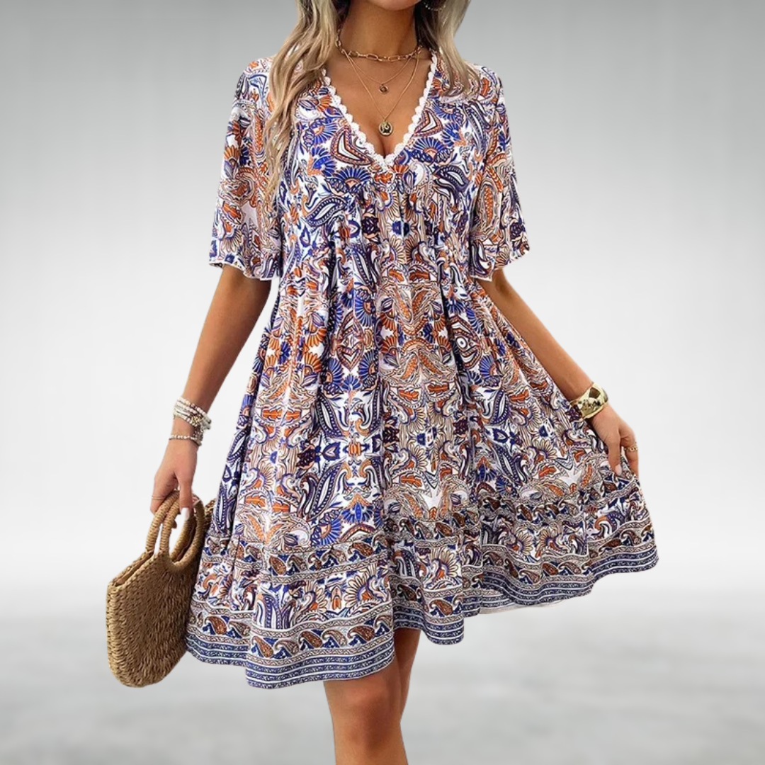 Stylish women's mini dress in a rich paisley print, short sleeves & boho style. Great for vacation or summer outings.