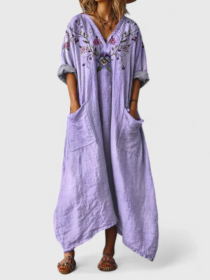 Boho print women's maxi dress. V-neck, 3/4 sleeves, relaxed fit, and useful pockets for everyday style.