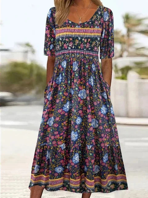 Casual women's print midi dress in a bohemian style, featuring short sleeves, a round neck, and a flowy silhouette.