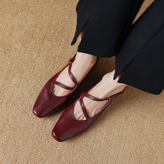 Women's burgundy leather pumps with tapered heel, elegant and comfortable for formal wear