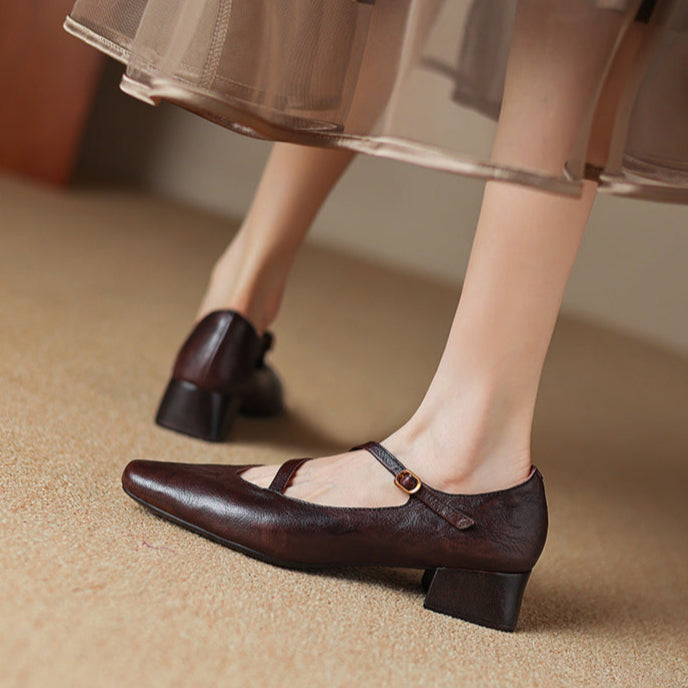 Sophisticated brown leather pumps, featuring a comfortable tapered heel for a polished look