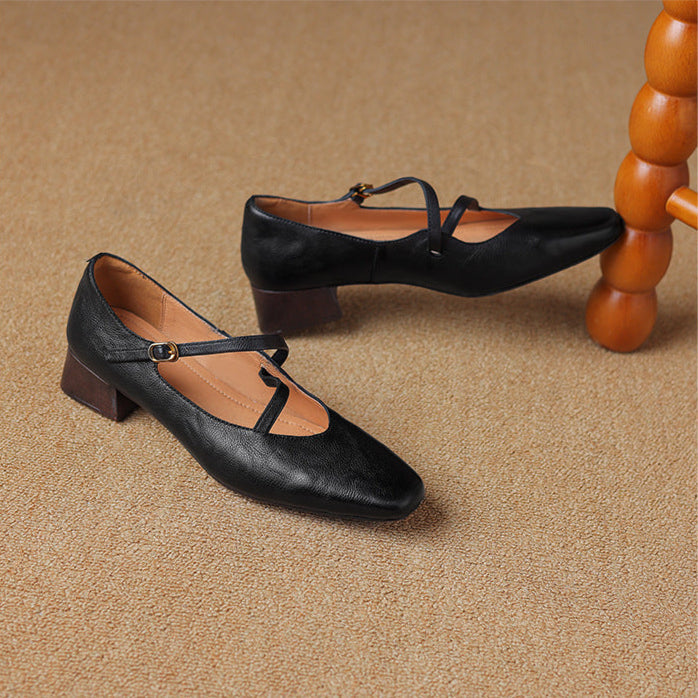 Stylish women's black leather pumps, ideal for formal occasions with a tapered heel