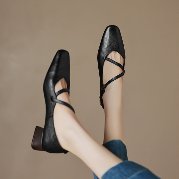 Women's formal black leather pumps, featuring a subtle yet elegant tapered heel
