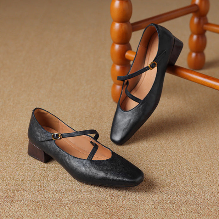 Fashionable women's burgundy leather pumps with a unique tapered heel for a chic look