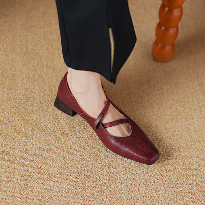 Elegant brown leather pumps with a modern tapered heel, perfect for work or formal events