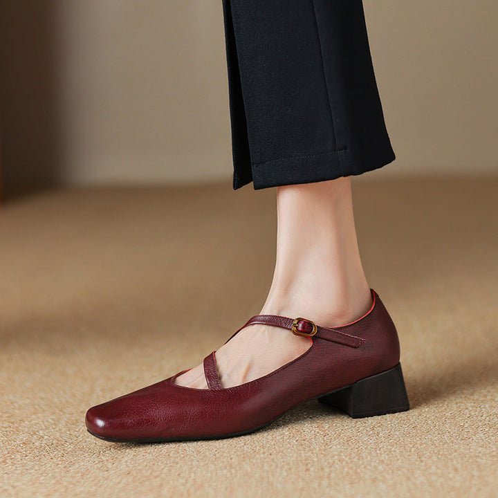 Close-up of the tapered heel on women's genuine leather pumps, black color