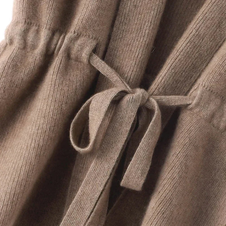 Fashionable women's belted sleeveless knit vest in a premium cashmere blend