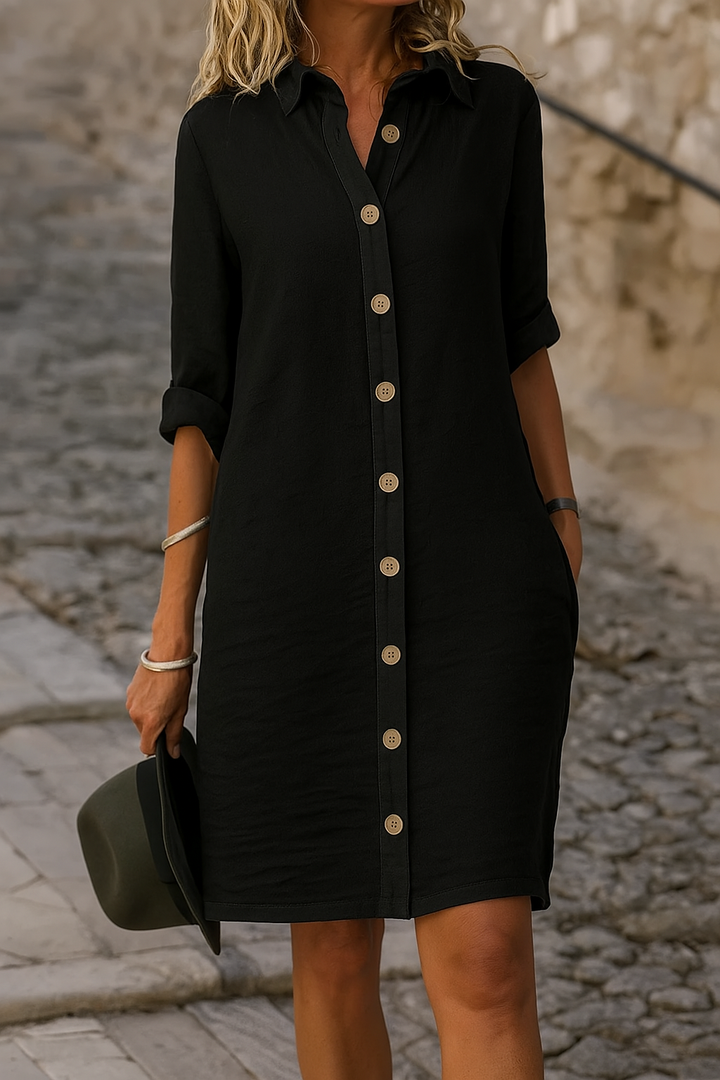 Modern women's shirt dress, casual, collared, roll tab sleeves, great for everyday wear.