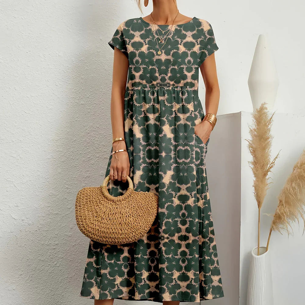 Chic women's flowing midi dress with cap sleeves for a relaxed, comfortable spring and summer fit.