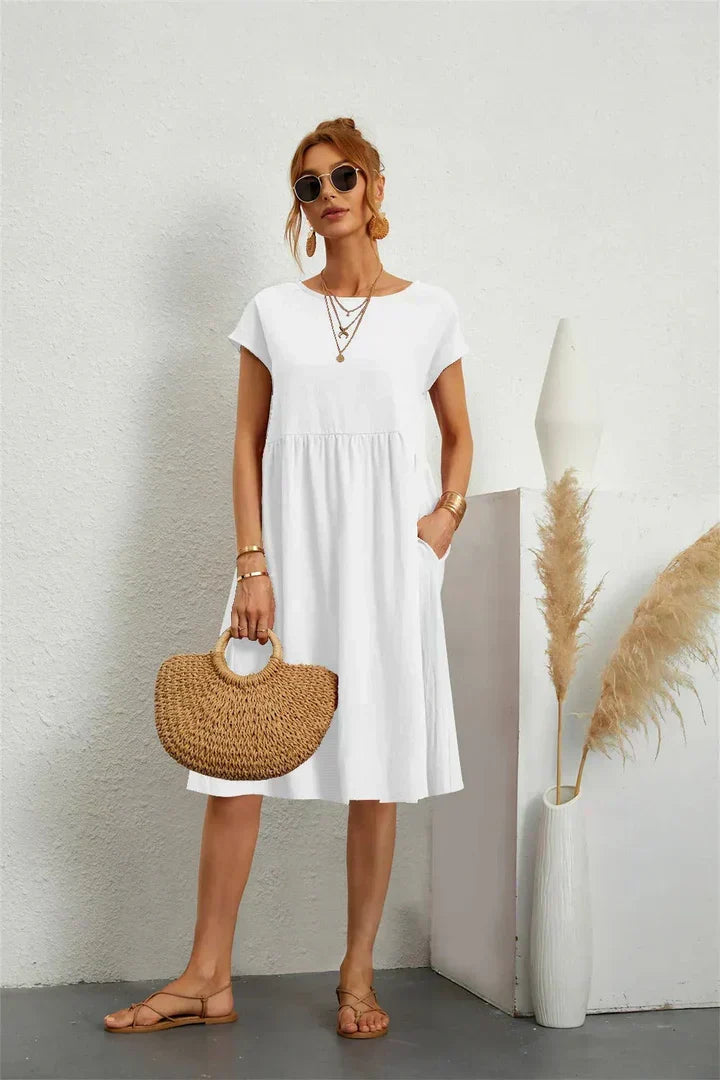 Everyday comfort: Women's casual midi dress with short sleeves and pockets for versatile wear.
