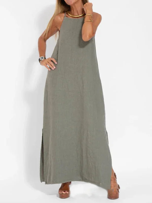Relaxed fit sleeveless maxi dress for women, featuring a comfortable flowy design & side slit.
