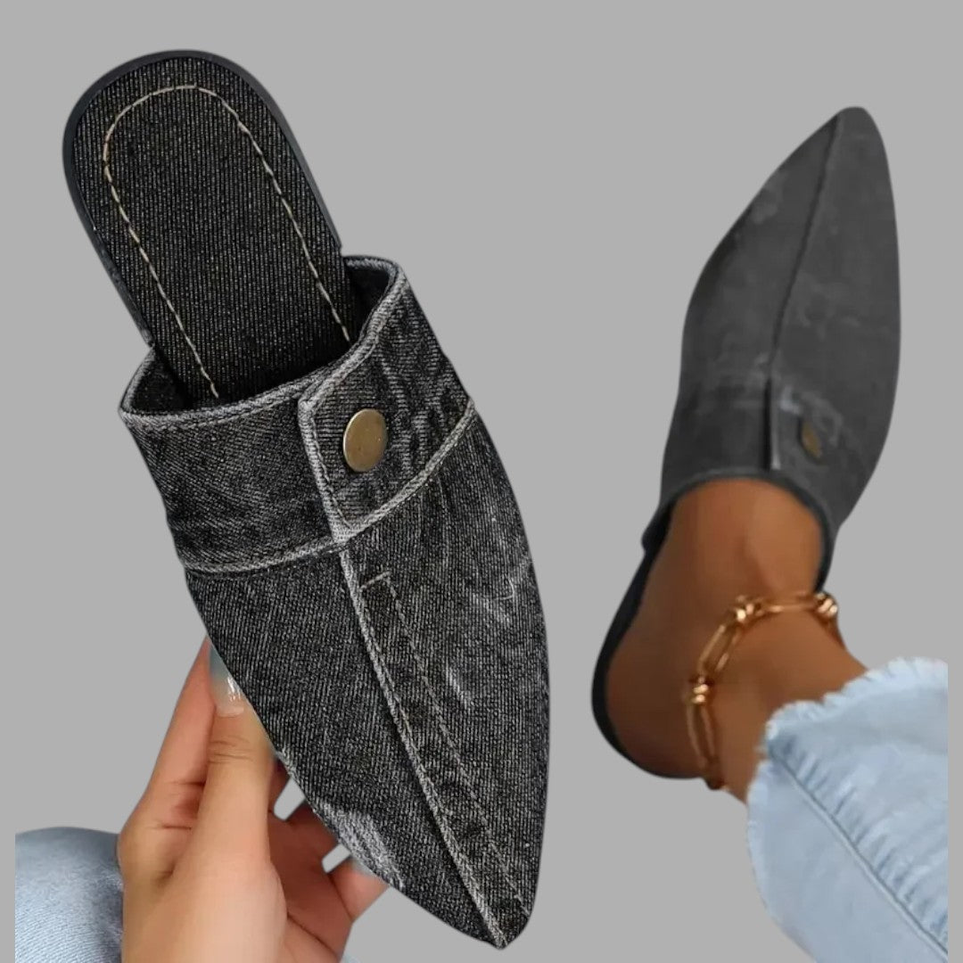 Stylish navy women's slip-on mule sandals, flat & comfortable for casual summer fashion.
