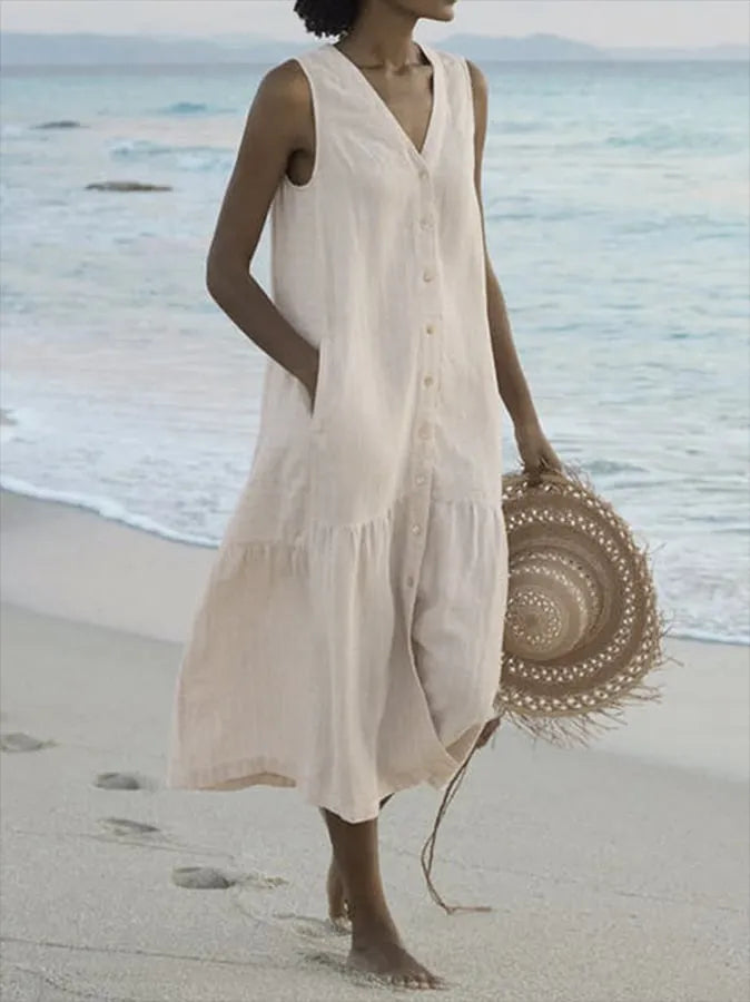 Comfortable tiered summer dress for women with V-neck and button-front. Ideal for vacations.