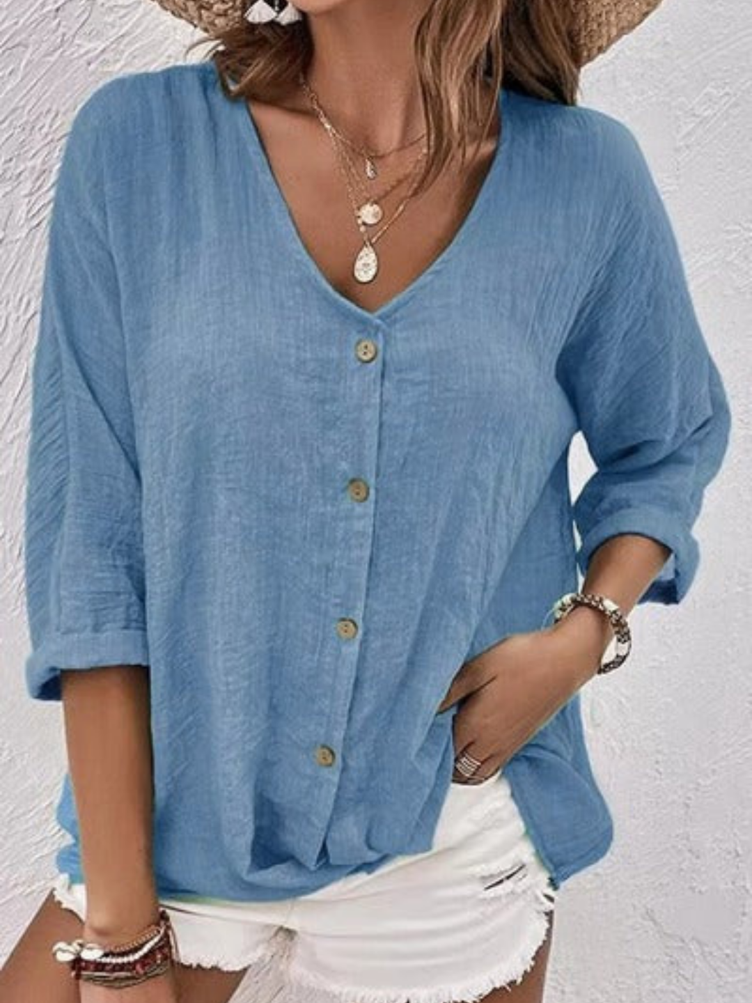 Comfortable women's V-neck button shirt for casual wear, designed with a relaxed fit for versatile style.