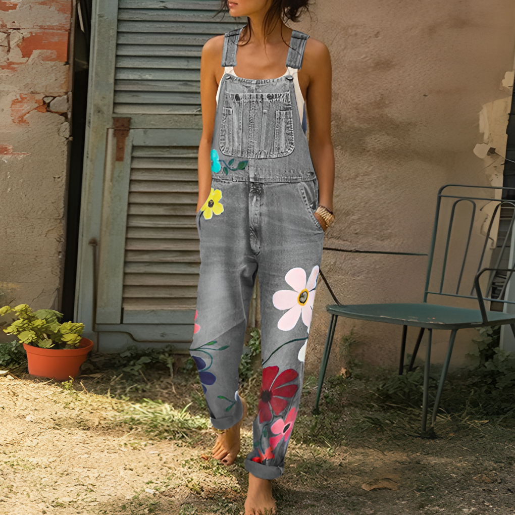 Casual women's floral denim jumpsuit, boho chic style. Ideal for spring, summer, or vacation wear. Light wash comfort.
