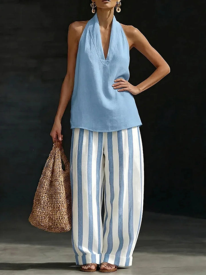 Fashionable women's summer outfit: a comfortable halter top and high-waisted wide leg pants, perfect for vacation.