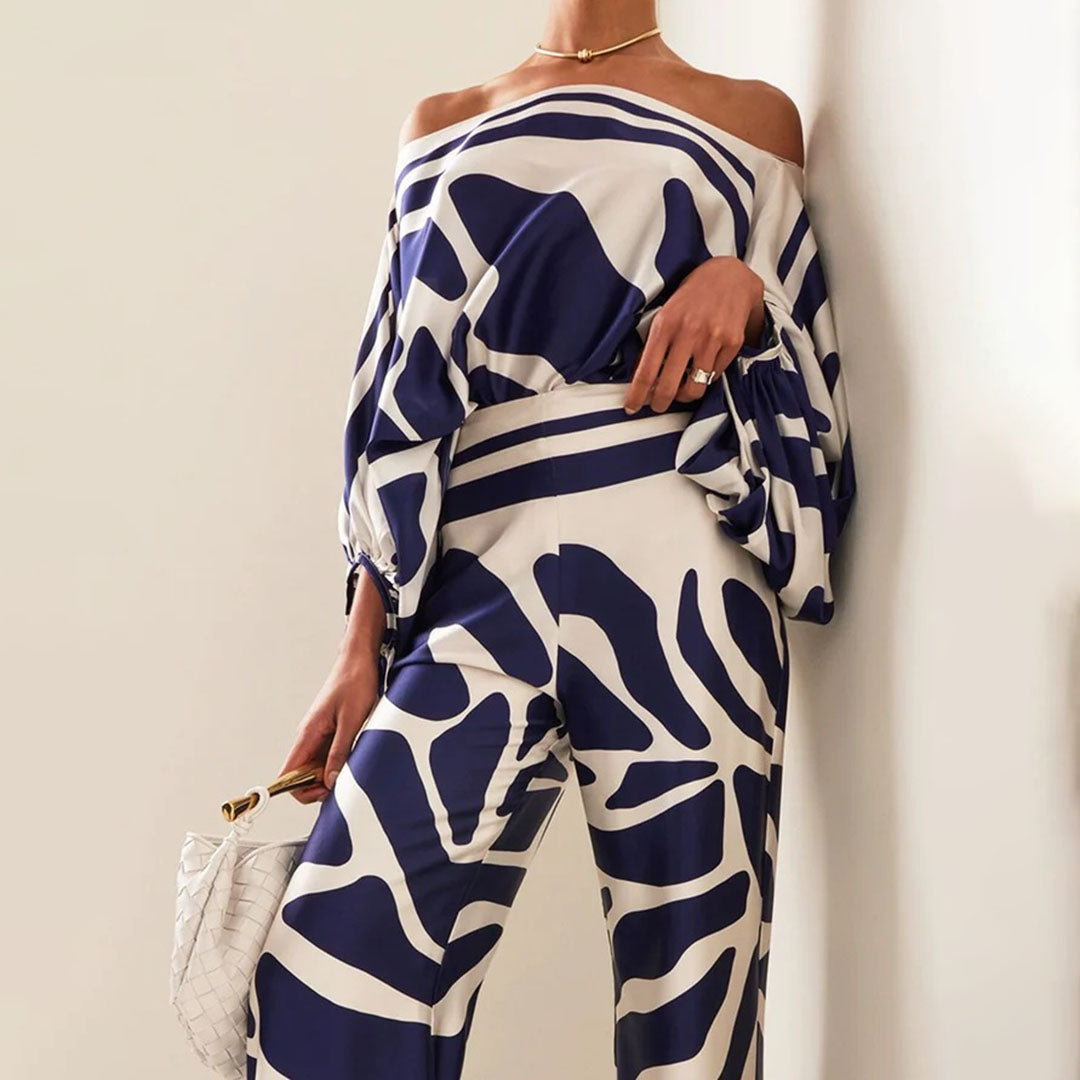 Close-up of the fabric and print on a women's off-shoulder summer two-piece matching set.
