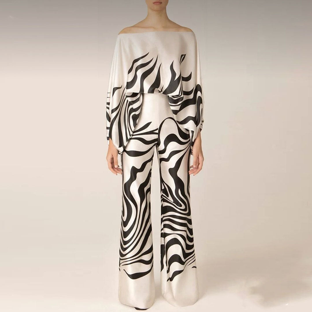 Trendy women's off-shoulder two-piece ensemble, a must-have casual printed set for summer fashion.