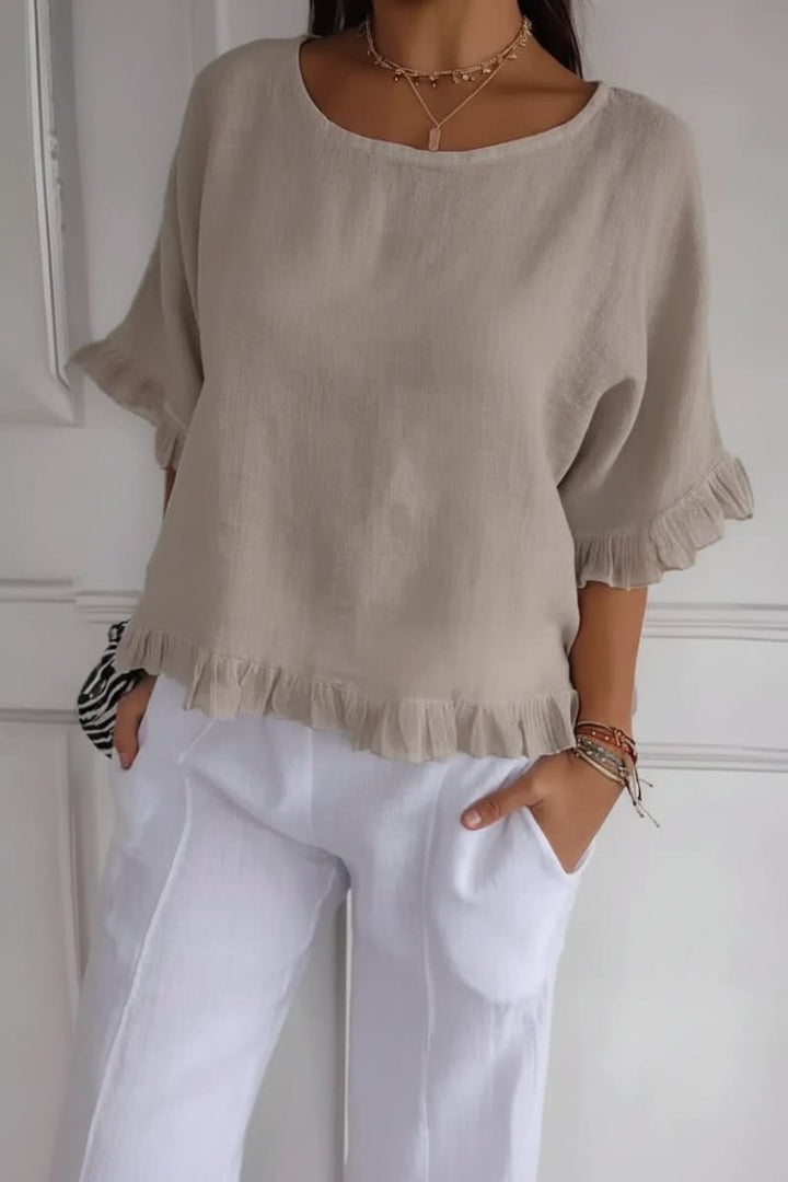 Lightweight women's summer ruffle blouse. Chic and breathable for warm weather fashion.