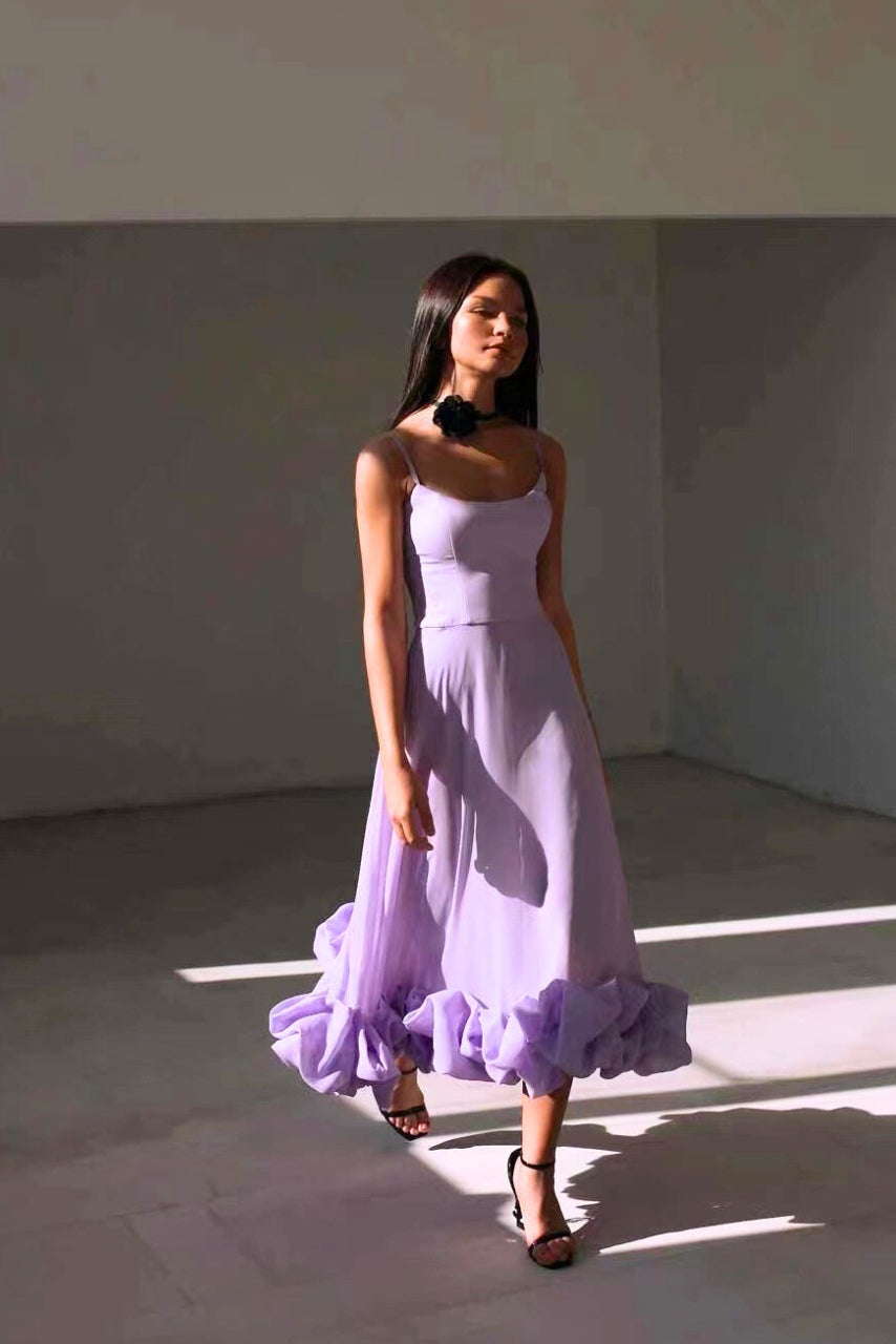 Summer-ready women's chic midi dress, featuring a lovely twirl, great for elegant events.