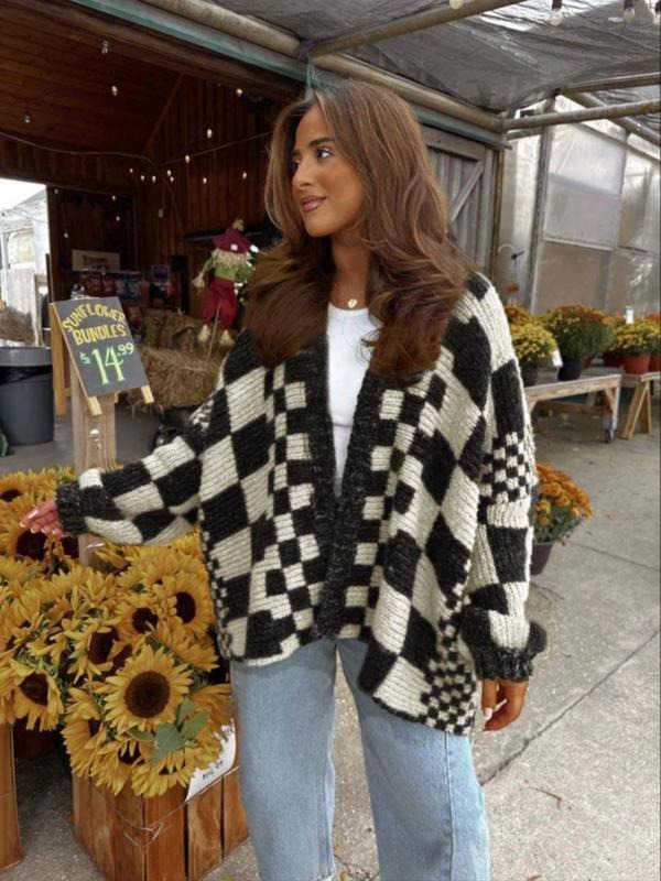 Close-up of a women's chunky knit check cardigan, showcasing soft acrylic blend texture