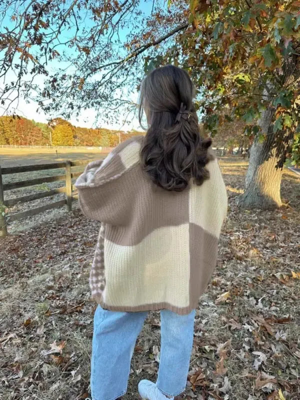 Back view of women's chunky knit check draped cardigan, highlighting the oversized silhouette