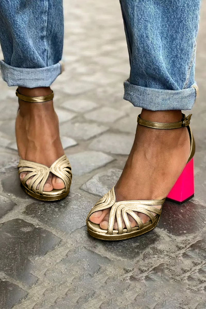 Stylish women's gold ankle strap sandals for casual wear. Comfortable open-toe design, perfect summer shoes.