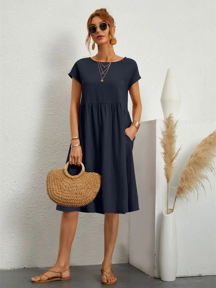 Essential comfortable women's casual midi dress with pockets, a must-have for everyday style.