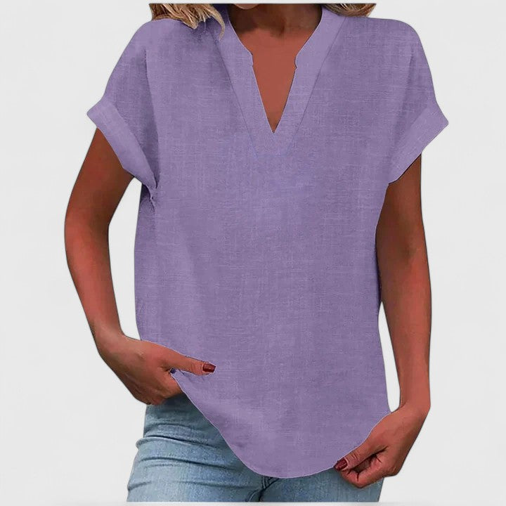 Comfortable V-neck short-sleeve women's blouse, relaxed fit, stylish for spring & summer.