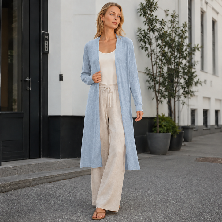Women's cozy long knit cardigan for fall & winter layering. Stylish and versatile outerwear.