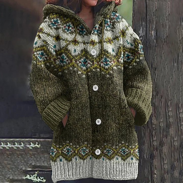 Women's button-front hooded knit cardigan in a relaxed fit, showcasing a classic Nordic pattern, ideal for layering.