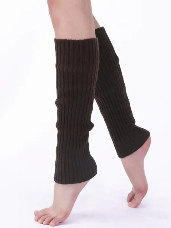 Stylish women's black ribbed knit leg warmers, an essential accessory for comfort and winter layering.