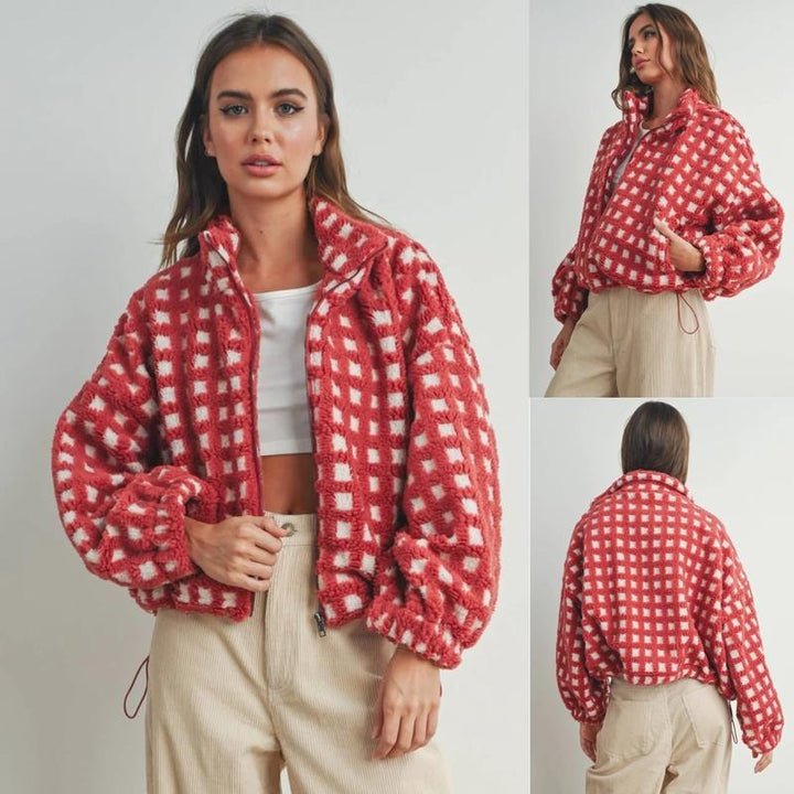 Women's cozy sherpa fleece jacket with a red and black check pattern, ideal for casual winter wear.