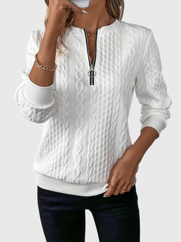 Women's cream cable knit quarter-zip pullover sweater, cozy & stylish for winter fashion.