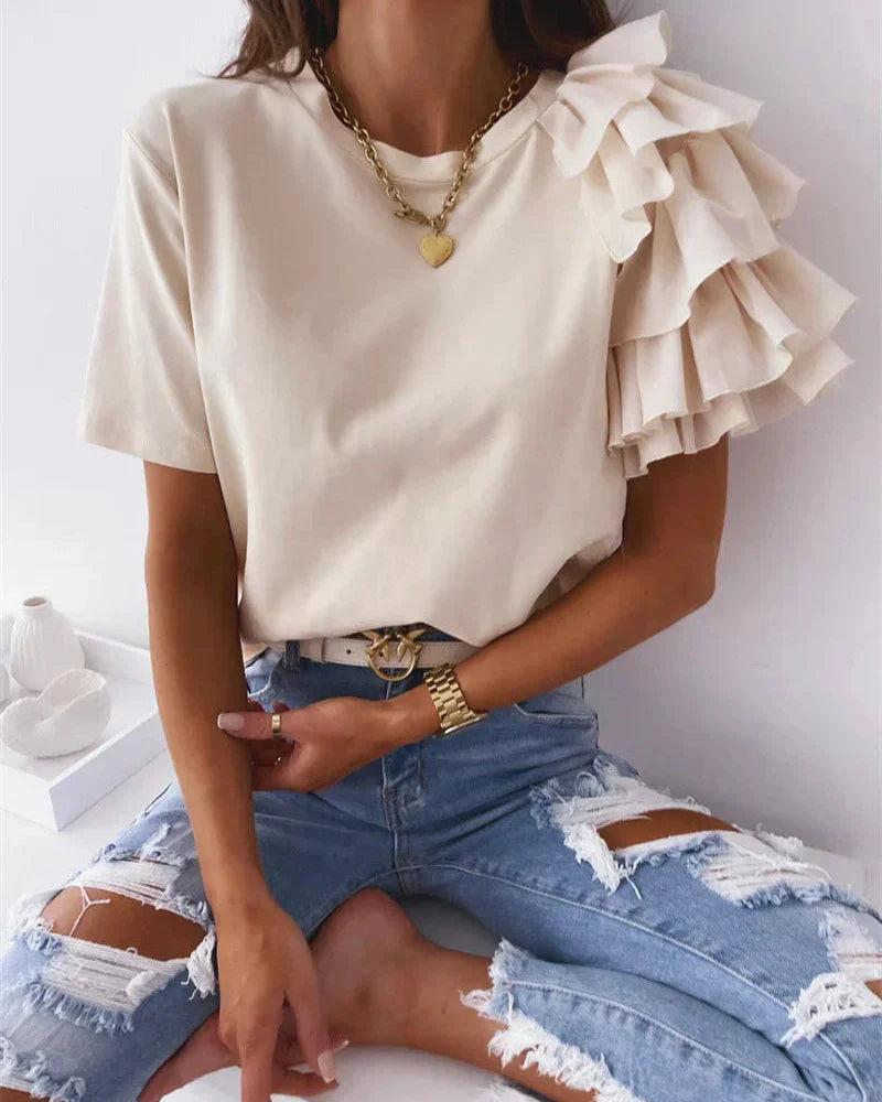Womens clothing: crew neck t-shirt featuring fashionable asymmetrical tiered ruffle sleeves. A versatile casual chic top.