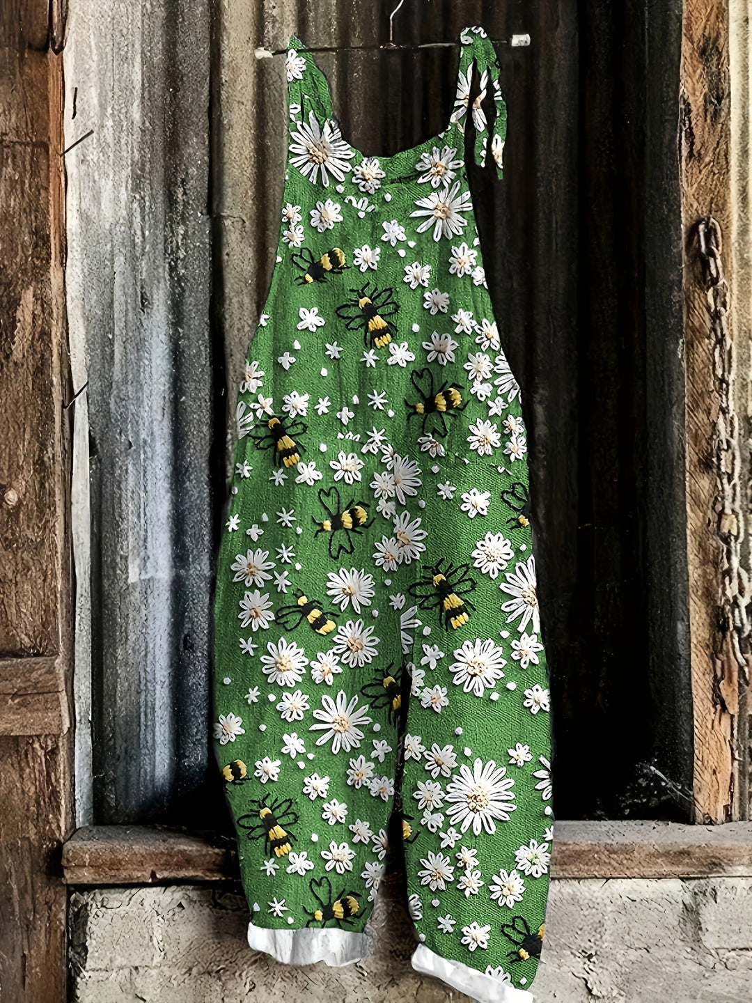 Relaxed fit women's jumpsuit with adorable daisy & bee floral print, ideal for summer outfits.