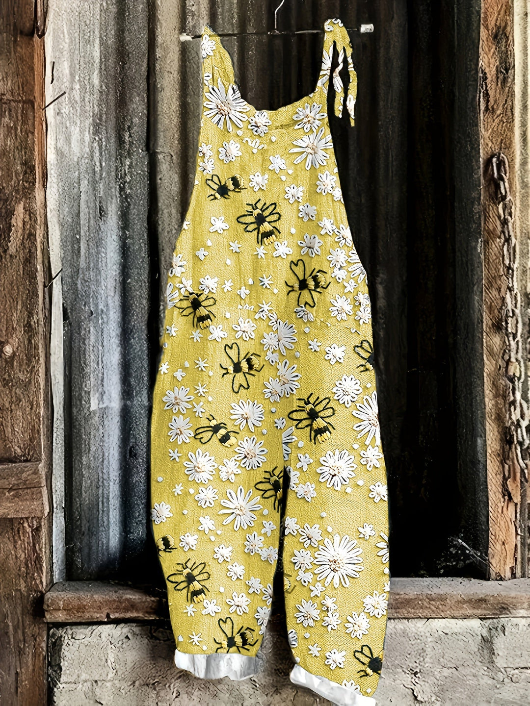 Summer women's daisy bee print tie-shoulder jumpsuit, with a comfortable wide-leg design.