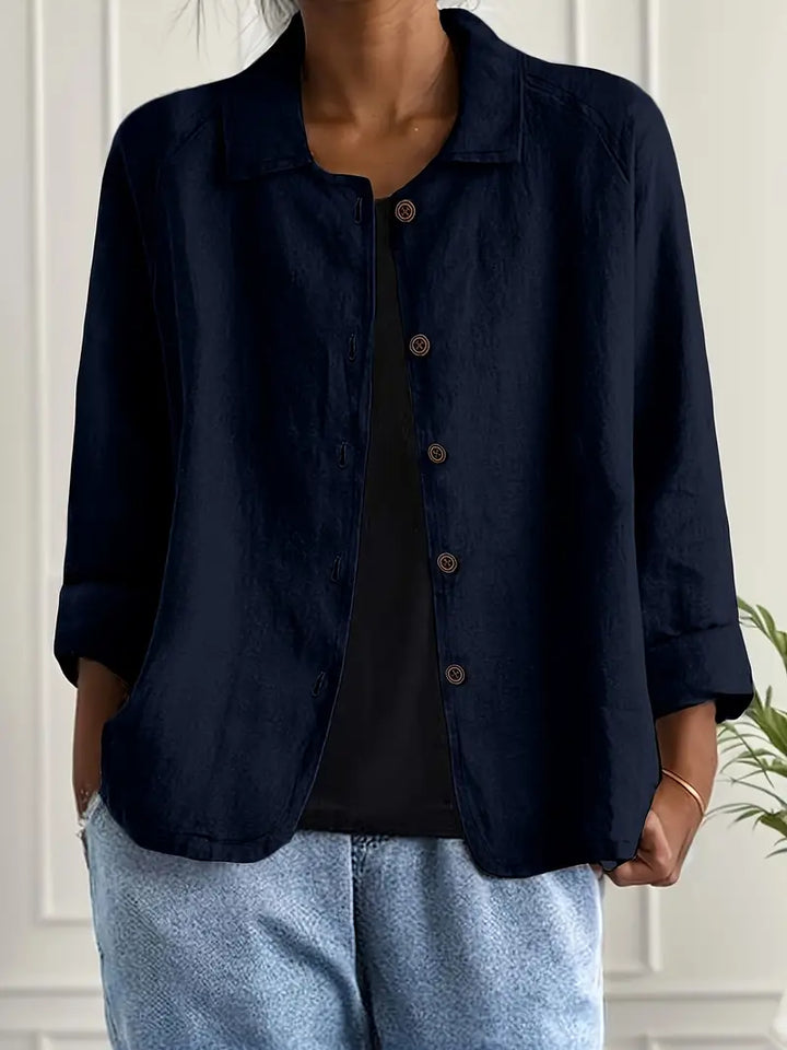 Women's casual collared top, button front, three-quarter sleeves, perfect for summer wear.