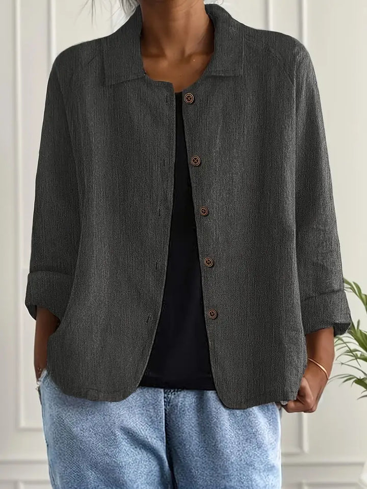 Versatile women's top, button-front design, relaxed fit, great for spring/summer fashion.