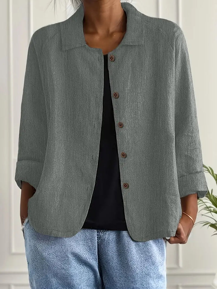 Effortless women's button-front top, 3/4 sleeves, relaxed fit for ultimate casual comfort.