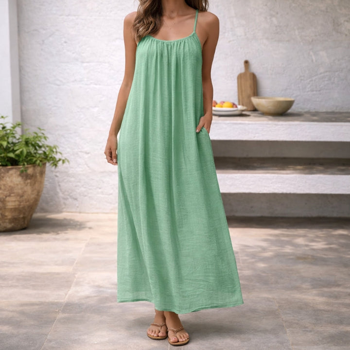 Casual scoop neck maxi sundress with spaghetti straps & pockets for women, a summer essential flowing dress.