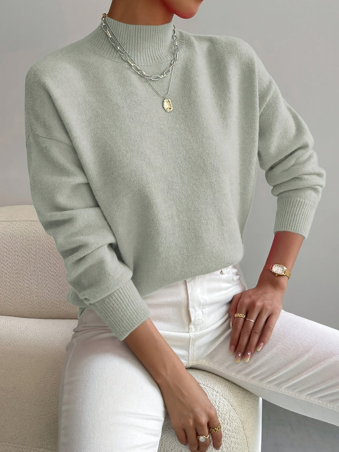Women's effortless mock turtleneck relaxed fit long sleeve sweater. Ideal for fall fashion.