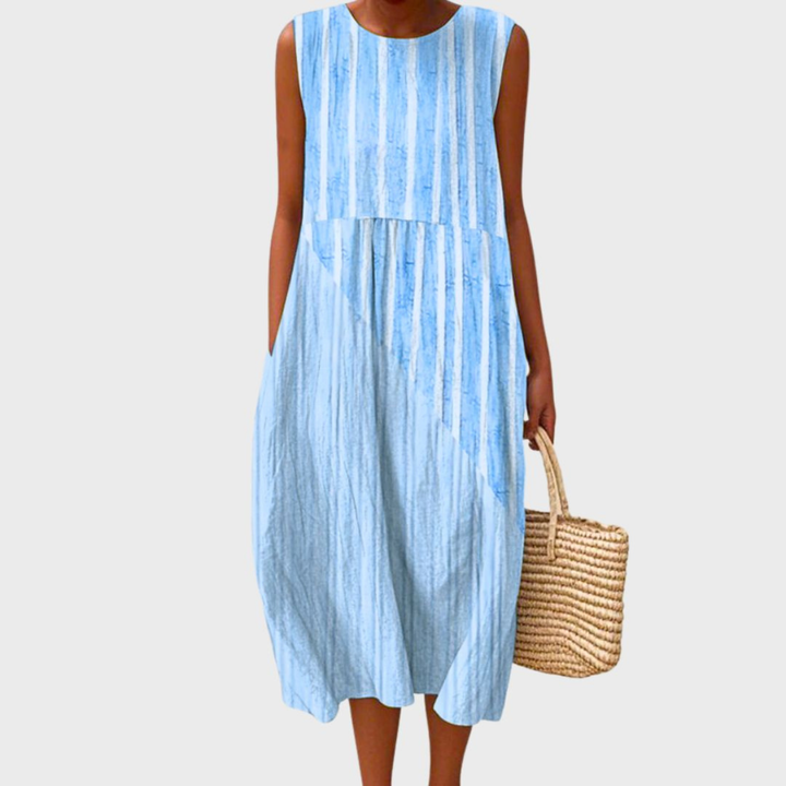 Stylish women's plaid sleeveless midi dress with a round neck. Tiered, lightweight fabric for summer comfort.