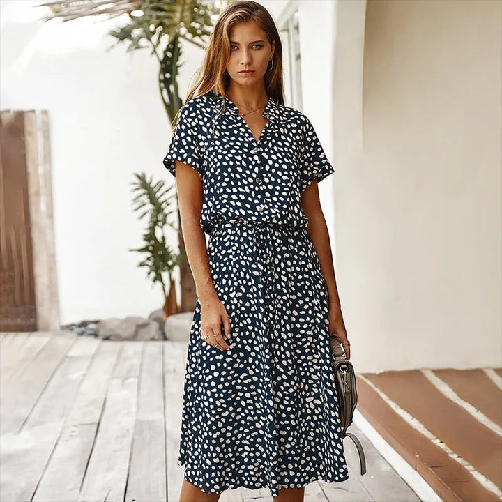 Effortless women's flowy printed midi dress, a comfortable and stylish choice for summer and vacation.